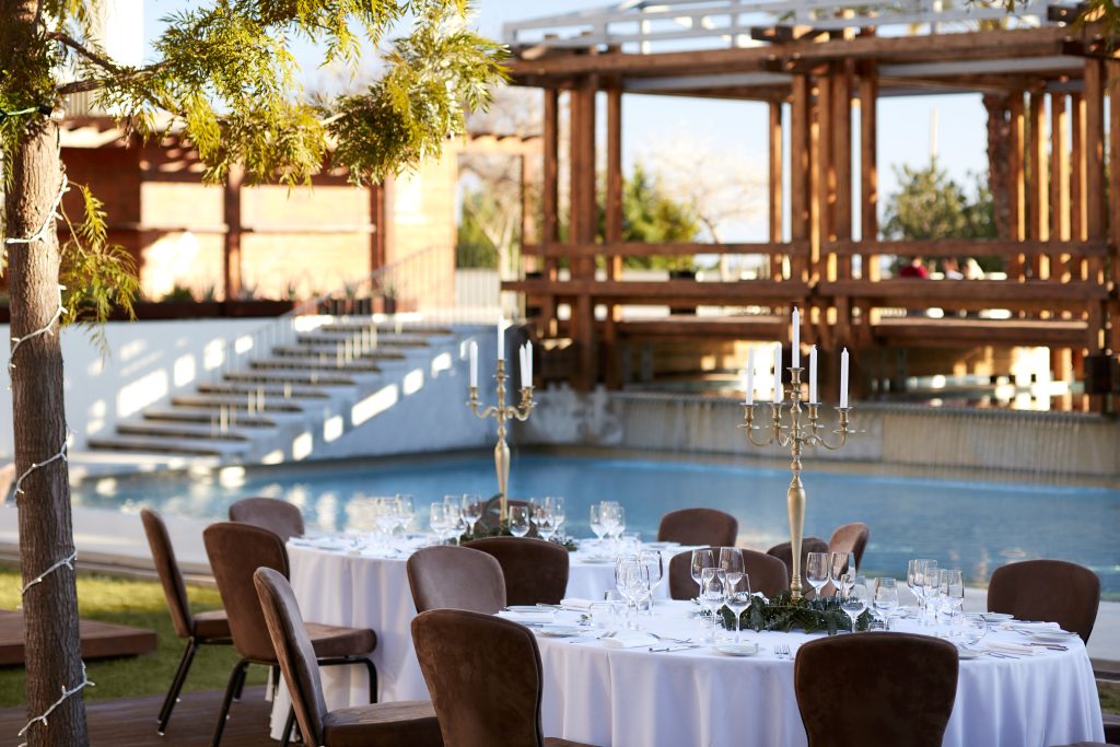 Victoria_Golf_Resort_&_Spa_Ballroom_Tables_Setup_Next_To_Cascades_Pool